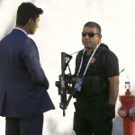 Members of security talk during G20 summit in Antalya