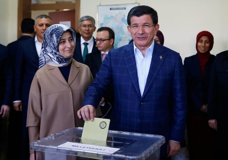 Turkish Prime Minister Ahmet Davutoglu casts his ballot with his wife Sare at a polling station during the parliamentary election in Konya, Turkey, November 1, 2015. Turks began voting on Sunday amid worsening security and economic worries in a snap parliamentary election that could profoundly impact the divided country's trajectory and that of President Tayyip Erdogan. The parliamentary poll is the second in five months, after the ruling AK Party founded by Erdogan failed to retain its single-party majority in June. REUTERS/Umit Bektas