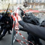 Demonstrators clash with CRS riot policemen near the Place de la Republique after the cancellation of a planned climate march  ahead of the World Climate Change Conference 2015 in Paris