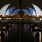 The blue, white and red colours of France's national flag are projected onto the sails of Sydney's Opera House in Australia