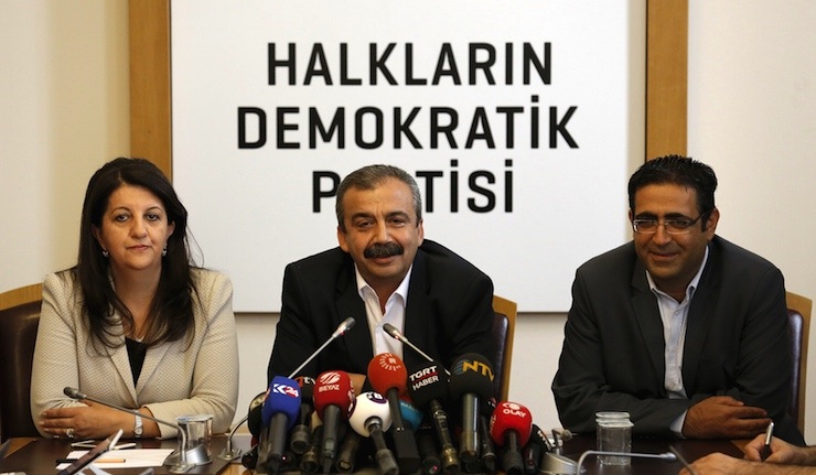 Pro-Kurdish politicians of Peoples' Democratic Party Sirri Sureyya Onder (C), Pervin Buldan (L) and Idris Baluken attend a news conference in Ankara, Turkey, June 12, 2015. REUTERS/Umit Bektas