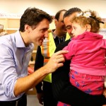 Syrian refugees are greeted by Canada's Prime Minister Justin Trudeau on their arrival from Beirut at the Toronto Pearson International Airport