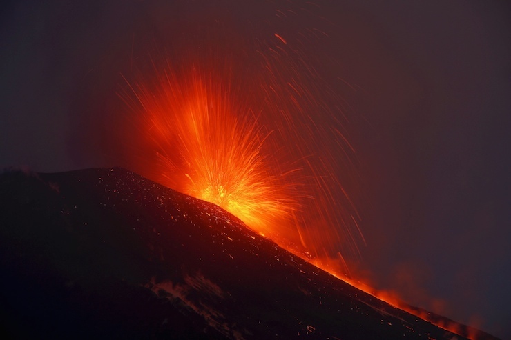 Italy's Mount Etna, Europe's tallest and most active volcano, spews lava as it erupts on the southern island of Sicily