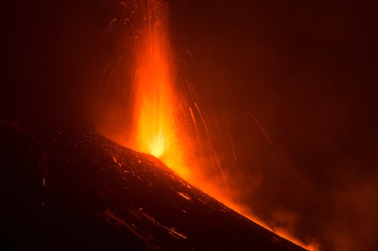 Italy's Mount Etna, Europe's tallest and most active volcano, spews lava as it erupts on the southern island of Sicily