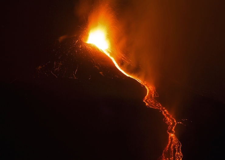 Italy's Mount Etna, Europe's tallest and most active volcano, spews lava as it erupts on the southern island of Sicily