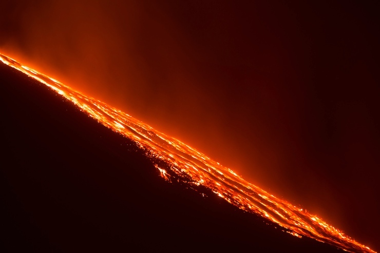 Italy's Mount Etna, Europe's tallest and most active volcano, spews lava as it erupts on the southern island of Sicily