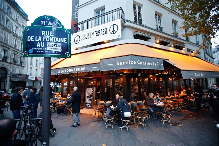 Customers sit on the terrace of the "A La Bonne Biere" cafe in Paris as it re-opens for business three weeks after shooting attacks which killed 130 people in the French capital