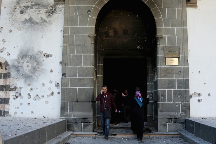 People visit Fatih Pasa mosque, known as Kursunlu mosque, which was damaged during the security operations and clashes between Turkish security forces and Kurdish militants, in Sur district of Diyarbakir, Turkey