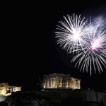 Fireworks explode over the temple of the Parthenon atop Acropolis hill during New Year's day celebrations in Athens