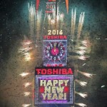 Fireworks shoot out the side of the sign during New Year celebrations in the Manhattan borough of New York