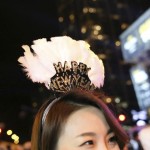 Kate Kim from Chicago wears a holiday tiara while celebrating before the New Year at Chi-Town Rising in Chicago