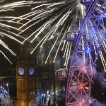 Fireworks explode around the London Eye wheel, the Big Ben clock tower and the Houses of Parliament to mark the beginning of the New Year in London