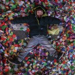 A child makes an angel in the confetti on the ground during New Year celebrations in the Manhattan borough of New York