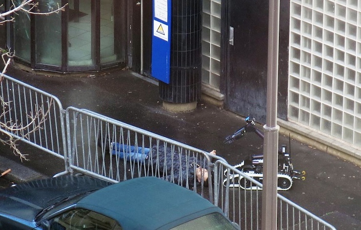 ATTENTION EDITORS - VISUAL COVERAGE OF SCENES OF INJURY OR DEATHFrench police use a bomb disposal robot to inspect the body of a man shot dead at a police station in the 18th district in Paris, France January 7, 2016. Police in Paris on Thursday shot dead a knife-wielding man who tried to enter a police station, police union sources said. The incident took place on the anniversary of last year's deadly Islamist militant attacks on the Charlie Hebdo satirical magazine in the French capital. Handout via Social Media Website/Anna PolonyiATTENTION EDITORS - THIS PICTURE WAS PROVIDED BY A THIRD PARTY. REUTERS IS UNABLE TO INDEPENDENTLY VERIFY THE AUTHENTICITY, CONTENT, LOCATION OR DATE OF THIS IMAGE. FOR EDITORIAL USE ONLY. NOT FOR SALE FOR MARKETING OR ADVERTISING CAMPAIGNS. THIS IMAGE WAS PROCESSED BY REUTERS TO ENHANCE QUALITY, AN UNPROCESSED VERSION WILL BE PROVIDED SEPARATELY. EDITORIAL USE ONLY. NO RESALES. NO ARCHIVE. TPX IMAGES OF THE DAY