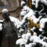 A statue of the late Pope John XXIII is covered by snow at the courtyard of the St. Antuan Catholic church in central Istanbul