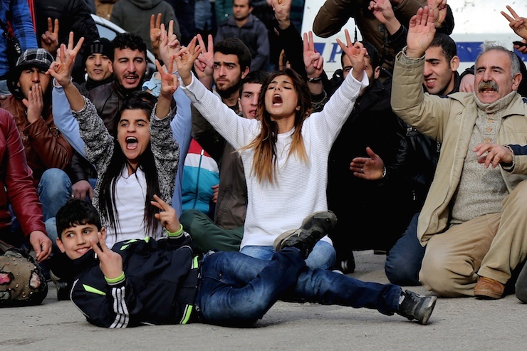 Kurdish demonstrators shout slogans during a protest against a curfew in Sur district and security operations in the region, in Diyarbakir, Turkey