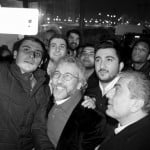 Editor-in-chief of Cumhuriyet Can Dundar poses for a selfie with his supporters after being released from prison outside the Silivri prison complex near Istanbul