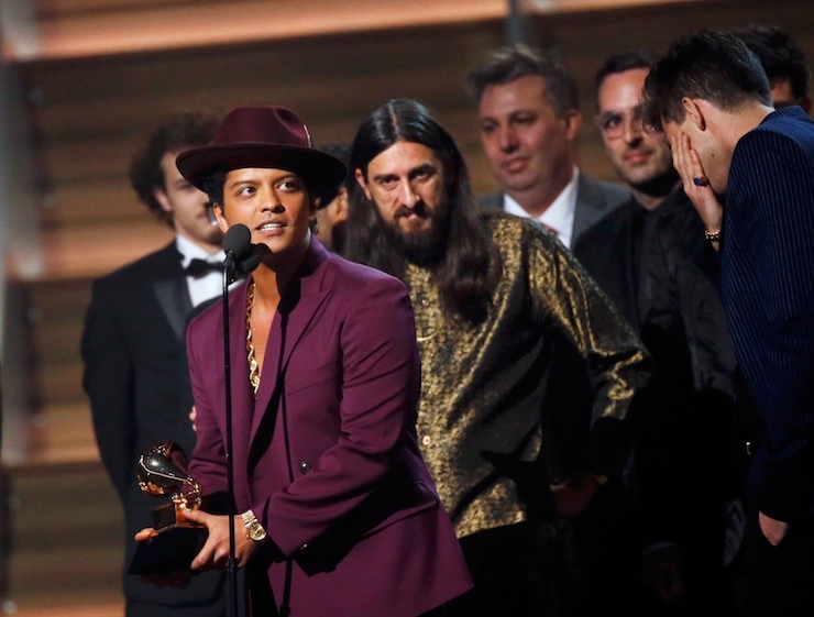Bruno Mars accepts the Best Record of the Year award during the 58th Grammy Awards in Los Angeles