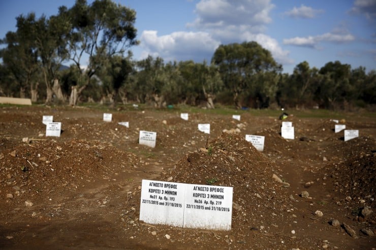 Tombstones are placed on graves of unidentified refugees and migrants who drowned at sea during an attempt to cross a part of the Aegean Sea from the Turkish coast, at a cemetery near the village Kato Tritos on the Greek island of Lesbos February 6, 2016. The tombstones read "Unknown infant, Girl 3 months old, no.31" (L) and "Unknown infant, Girl 3 months old, no.36". Picture taken February 6, 2016. REUTERS/Giorgos Moutafis TPX IMAGES OF THE DAY