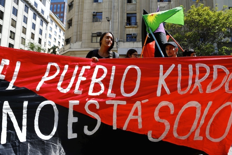 Demonstrators protest against Turkish President Erdogan's visit, in front of the government house, in Santiago