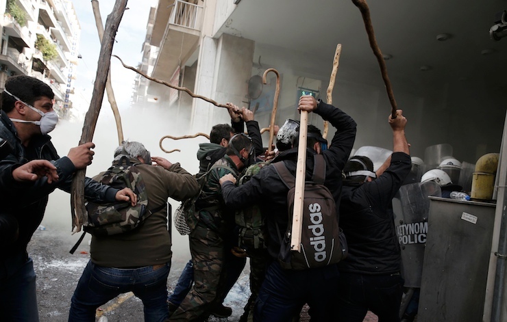 Greek farmers from the region of Crete clash with police during a protest against planned pension reforms outside the Agriculture ministry in Athens