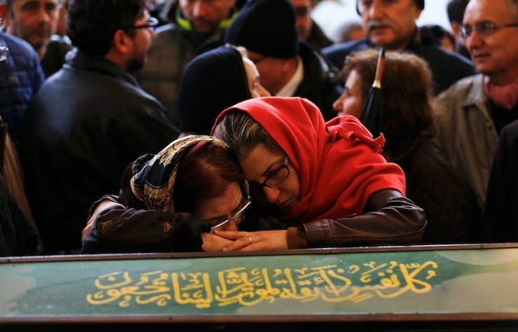 Women mourn over the coffin of a car bombing victim during a commemoration ceremony in a mosque in Ankara, Turkey, March 14, 2016. REUTERS/Umit Bektas