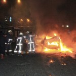 Emergency personnel work near a burning vehicle after an explosion in Ankara