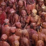 Hindu devotees take part in the religious festival of Holi, also known as the festival of colours, in the Nandgaon temple in Mathura
