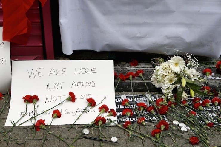 Carnations and a sign are placed at the scene of a suicide bombing at Istiklal street, a major shopping and tourist district, in central Istanbul