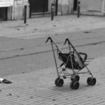 An abanonded childs pushchair stands in a street following a suicide bombing in central Istanbul