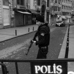 Police officer secures the area following a suicide bombing in central Istanbul