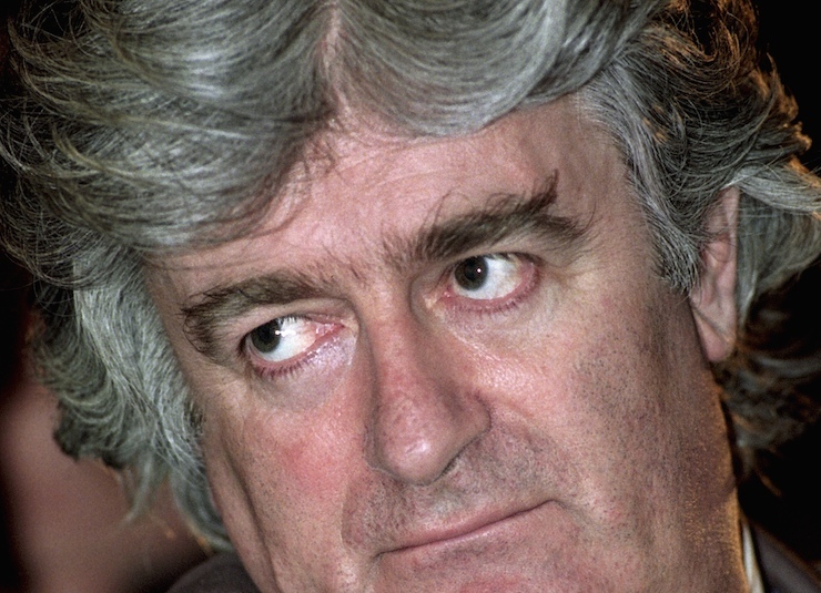 Radovan Karadzic attends a Bosnian Serb parliament session in Pale in this May 1993 file photo. U.N. judges will pronounce their verdict on March 24, 2016 in the genocide trial of former Bosnian Serb leader Karadzic over the 1995 Srebrenica massacre, Europe's worst atrocity since World War Two. REUTERS/Petar Kujundzic/Files
