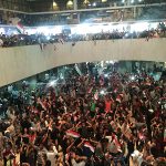 Followers of Iraq's Shi'ite cleric Moqtada al-Sadr are seen in the parliament building as they storm Baghdad's Green Zone in Iraq