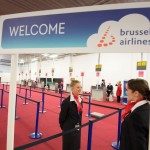 Brussels Airlines staff wait for passengers at Brussels Airport, which partially re-opened following a bomb blast 12 days ago, in Zaventem