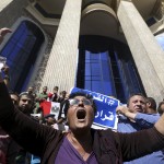 Egyptian activists shout slogans against President Abdel Fattah al-Sisi and his government, during a demonstration protesting the government's decision to transfer two Red Sea islands to Saudi Arabia, in front of the Press Syndicate Cairo