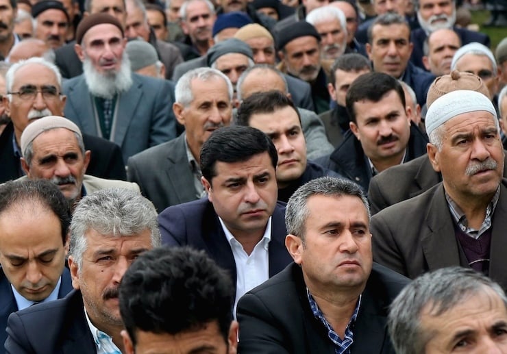 Selahattin Demirtas (C), co-leader of the pro-Kurdish Peoples' Democratic Party (HDP), attends the Friday prayers in Diyarbakir, Turkey March 4, 2016. REUTERS/Sertac Kayar TPX IMAGES OF THE DAY