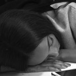 A model sleeps backstage before the presentation of the Burberry Prorsum Spring/Summer 2014 collection during London Fashion Week