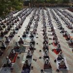 Students practice yoga during a training session ahead of World Yoga Day in Ahmedabad