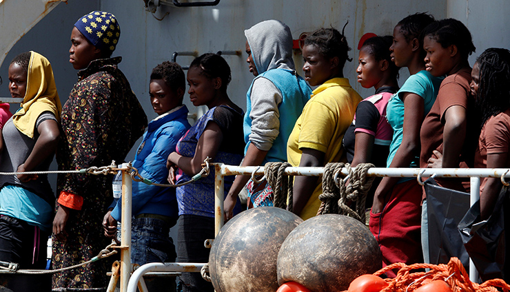 Migrants wait to disembark from the Italian Navy vessel Vega at the Reggio Calabria harbour, southern Italy, May 29, 2016. REUTERS/ Antonio Parrinello