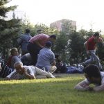 People take cover as shots are fired in Ankara