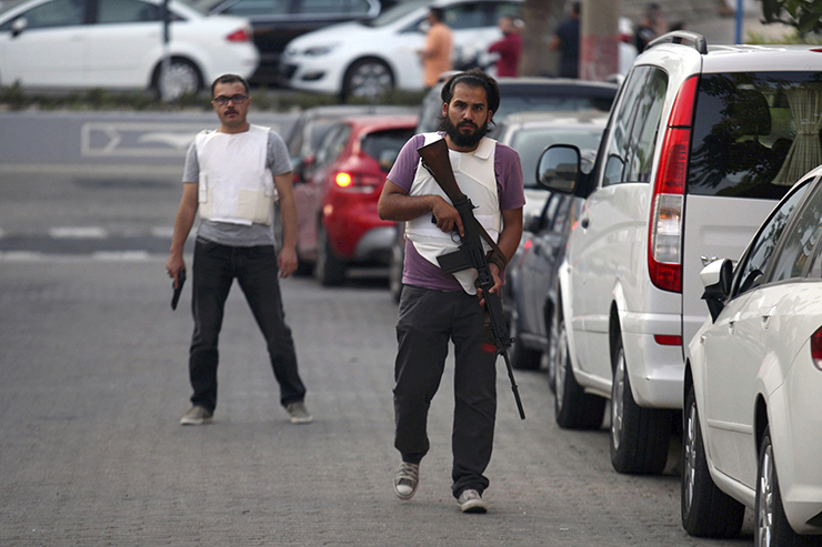 A plain clothes policeman patrols a street in the resort town of Marmaris