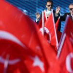 Turkey's President Erdogan greets the crowd during the opening ceremony of newly built Yavuz Sultan Selim bridge, the third bridge over the Bosphorus linking the city's European and Asian sides, in Istanbul