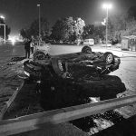A flipped car lies in a road near military headquarters in Ankara