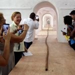 People look at the world's longest cigar that stretches 295 feet 4 inches (90 metres), in Havana, Cuba