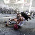 Riot police use a water cannon to disperse LGBT rights activist before a Gay Pride Parade in central Istanbul, Turkey