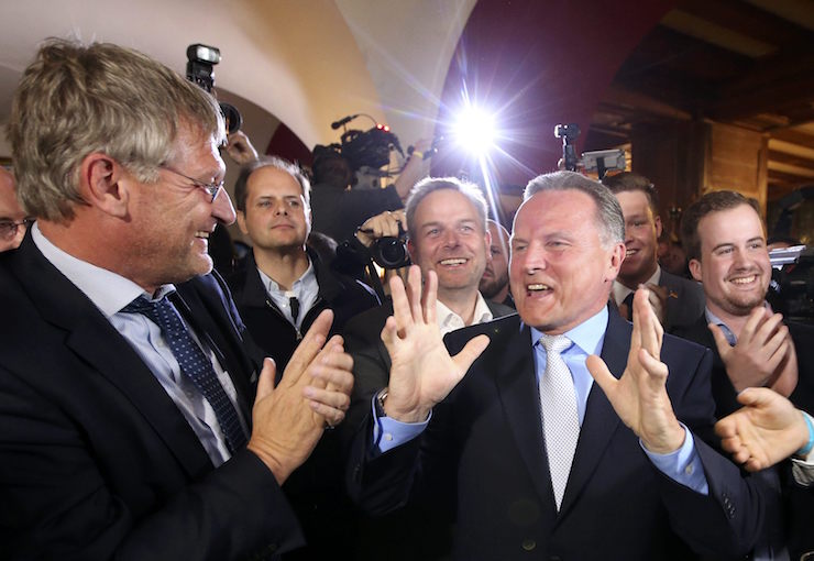 Top candidate of the anti-immigration party Alternative for Germany (AfD) Georg Pazderski and AfD co-leader Joerg Meuthen (L)react after first exit polls of the Berlin city-state elections, Germany September 18, 2016. REUTERS/Fabrizio Bensch