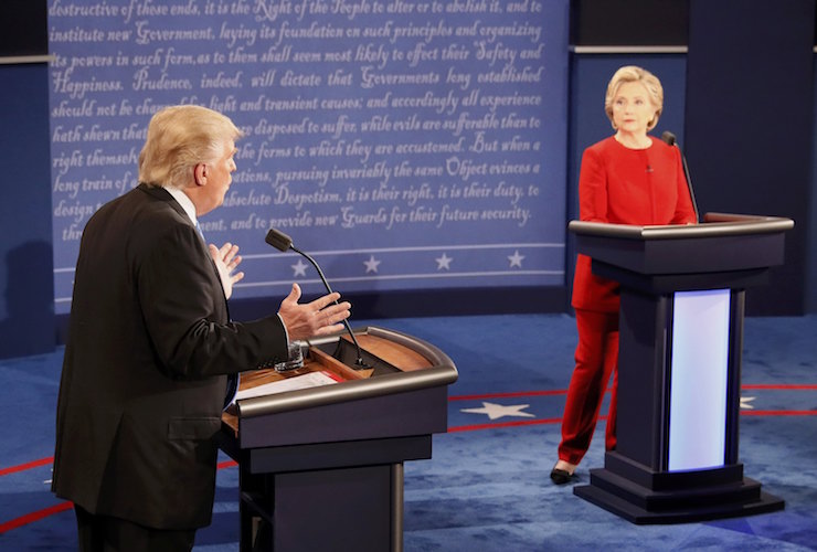 Republican U.S. presidential nominee Donald Trump speaks as Democratic U.S. presidential nominee Hillary Clinton listens during their first presidential debate at Hofstra University in Hempstead, New York, U.S., September 26, 2016. REUTERS/Rick Wilking