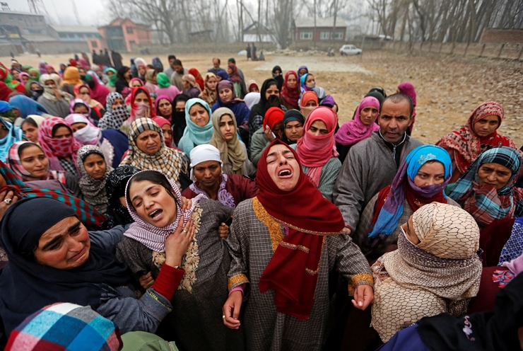 Women mourn during the funeral of suspected militant Rayees Ahmad Dar, who according to local media was killed in an encounter with the Indian armed forces in Pulwama district on Saturday afternoon, in Kakapora village, south of Kashmir
