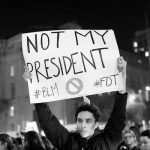 A demonstrator holds a sign during a protest in San Francisco, California, U.S. following the election of Donald Trump as the president of the United States
