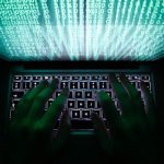 Illustration file picture shows a man typing on a computer keyboard in Warsaw